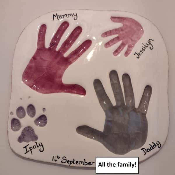 Family hand and paw prints